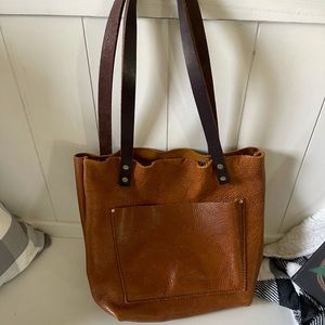 Used. Portland leather (small) nutmeg tote bag. Used one year.
